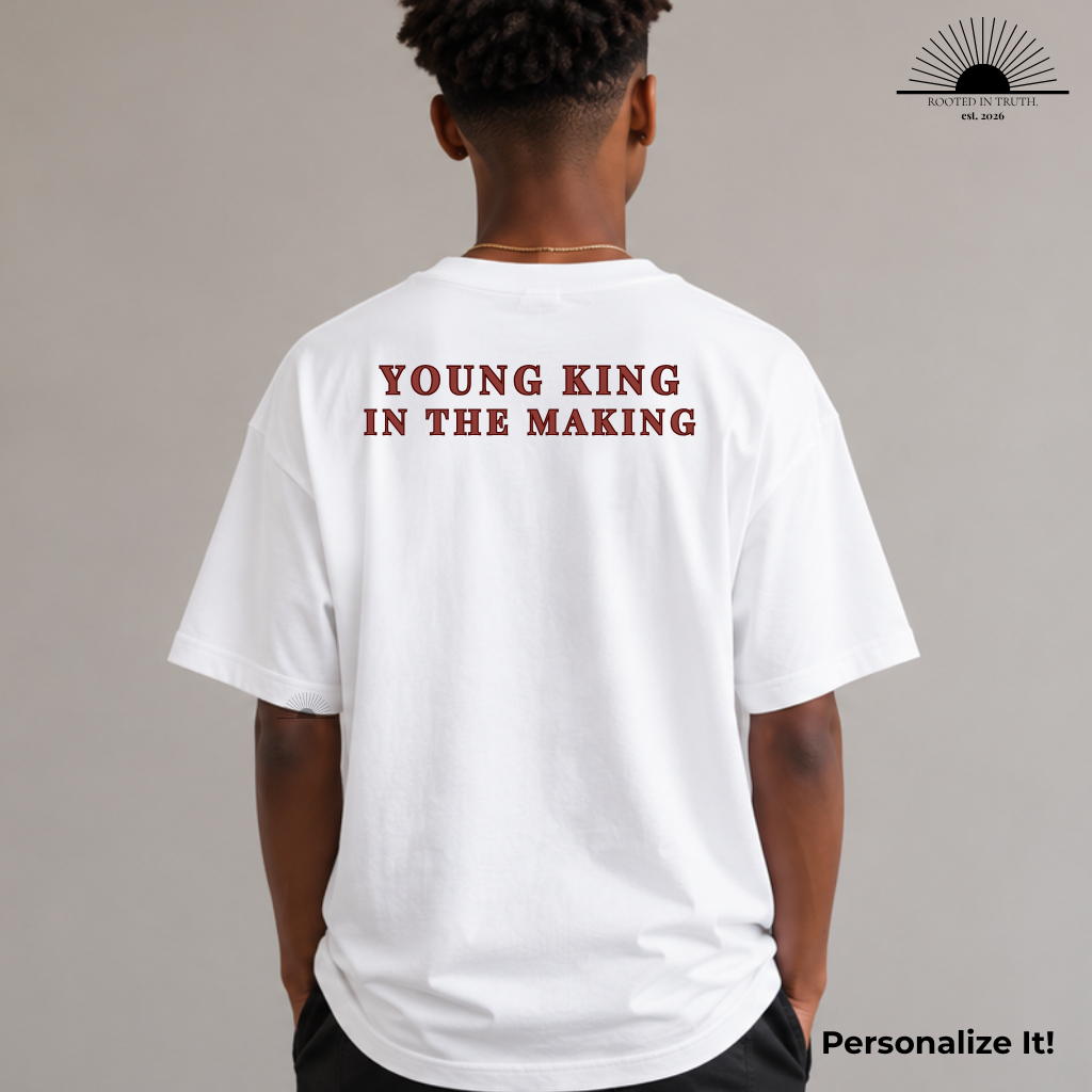White t-shirt with 'Young King in the Making' text on the back, worn by a person against a gray background.